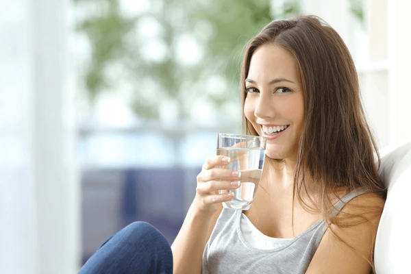 girl drinking water sitting on 600nw 324342278